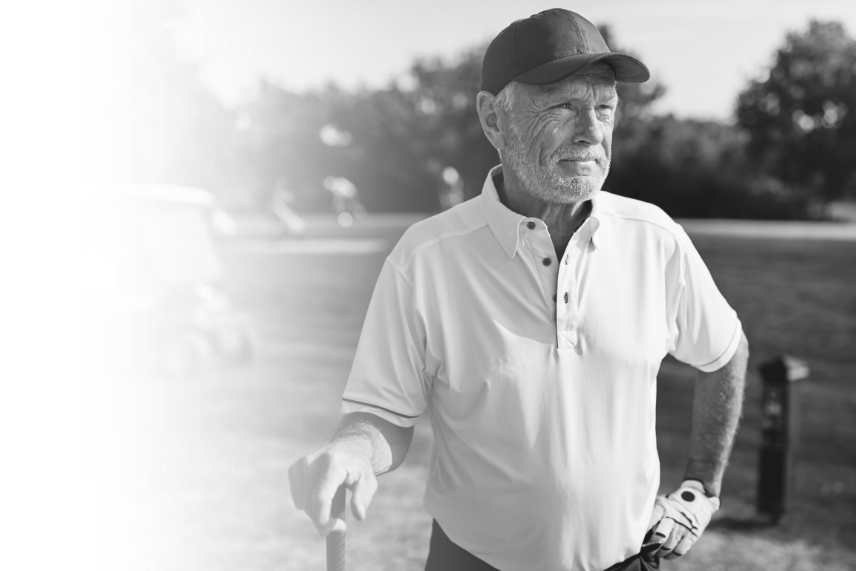 senior-man-looking-down-the-fairway-of-a-golf-cour-YQMLP93